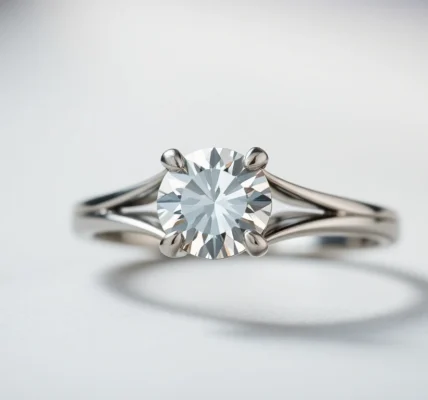 Elegant white gold engagement ring with a brilliant diamond centerpiece, showcasing craftsmanship.